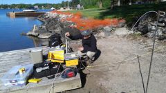 sampling nearshore water near Keewatin